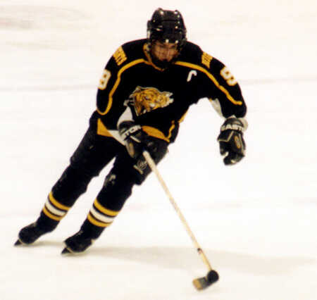 Lee Allen pushes the puck up ice.