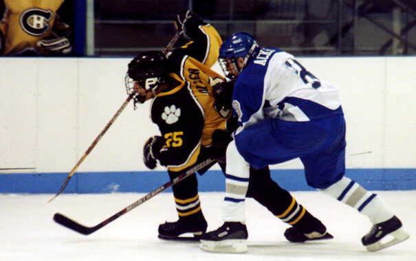 Lee Allen offers a piggyback ride to a Trinity Trojan.