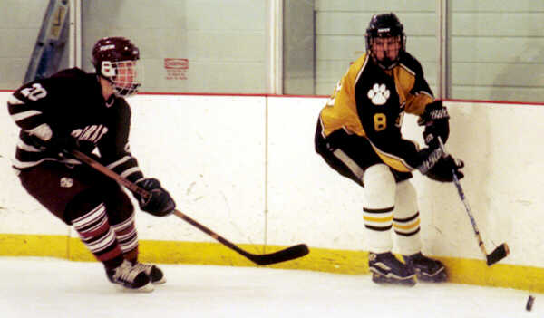 Kyle Barden moves the puck around the boards.