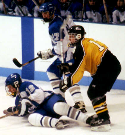 Brendon Benner runs into some Trojans.