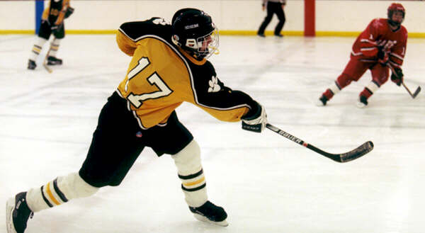 Brendon Benner dumps the puck into Shaker's zone.