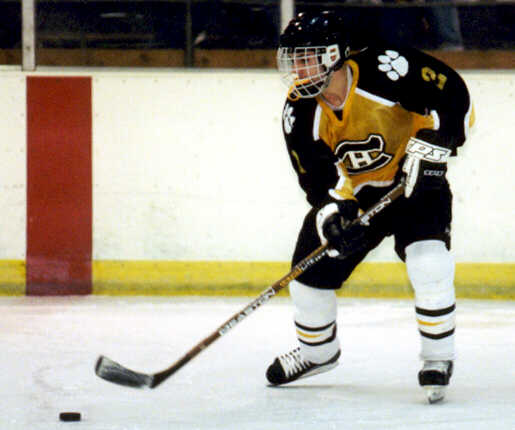 Brendon Benner plays the puck near the red line.