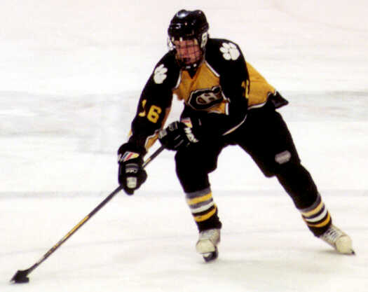 Milton Carter handles the puck.