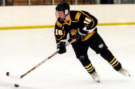 Milton Carter carries the puck.