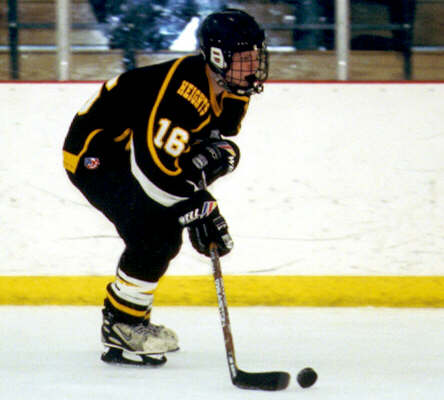 Milton Carter controls the rolling puck.