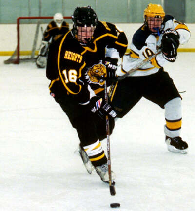 Milton Carter fends off a hook from Central Catholic.