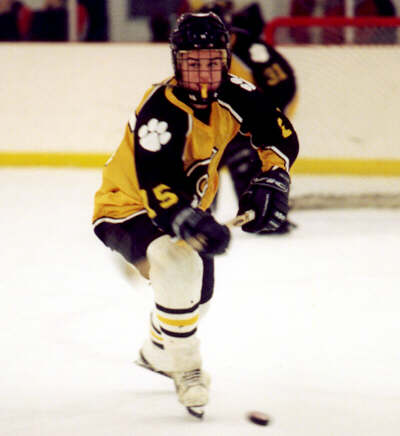Pat Collins clears the puck out of the defensive zone.