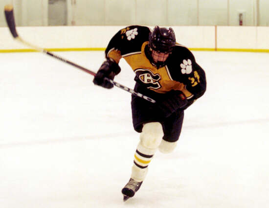 Dan Cross-Call races after the puck.