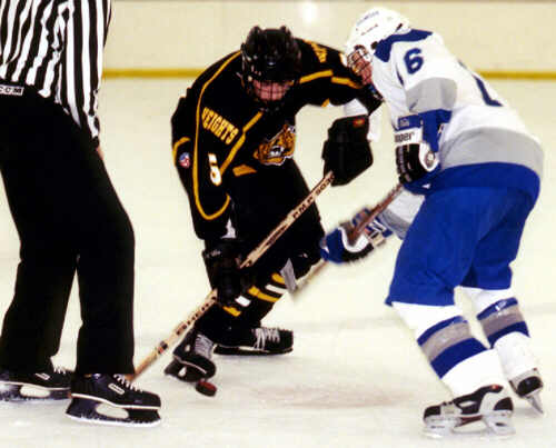 Dan Cross-Call takes a faceoff.