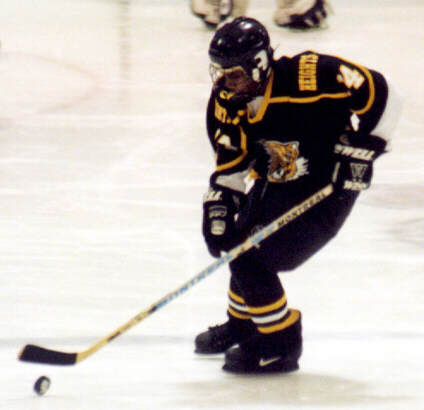 Marcus Dancy picks up the rolling puck.