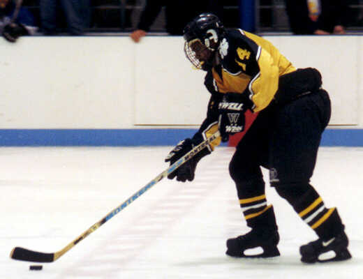 Marcus Dancy brings the puck over the red line.