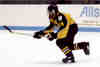 Marcus Dancy races toward the puck.