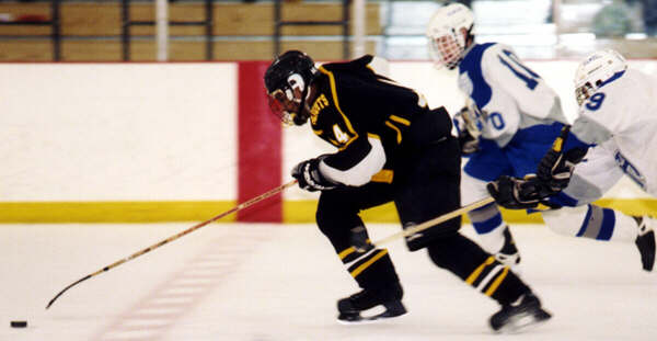 Marcus Dancy splits the defensemen.