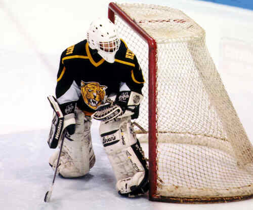 Ben Gaglioti follows the action in the corner.