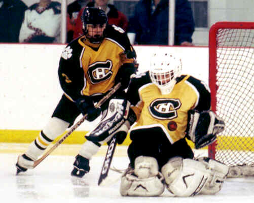 Jared Lavender watches Ben Gaglioti absorb a shot.