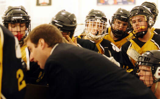 The Tigers listen to Head Coach Kirk Guenther.