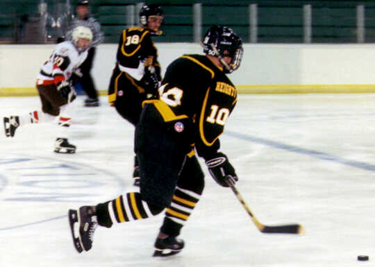 Jeremy Holmes and Mike Ruflin move the puck against Padua.