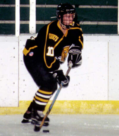 Jeremy Holmes holds the puck during a Heights powerplay.