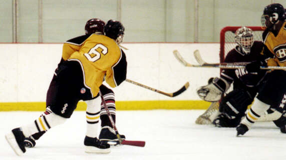 Marcus Dancy looks for the rebound after a Jeff Houser shot.