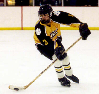 Jared Lavender carries the puck.