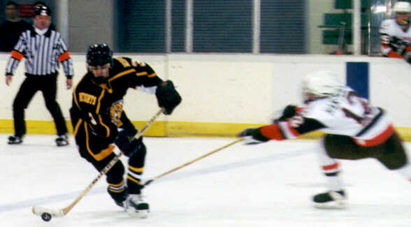 Jared Lavender stays out of reach of a Padua forechecker.