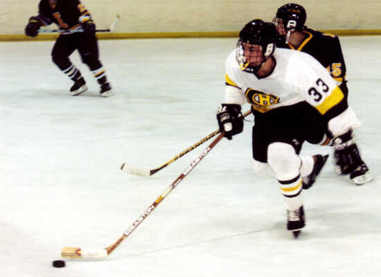 Mike Ruflin races out of the Tigers' zone.