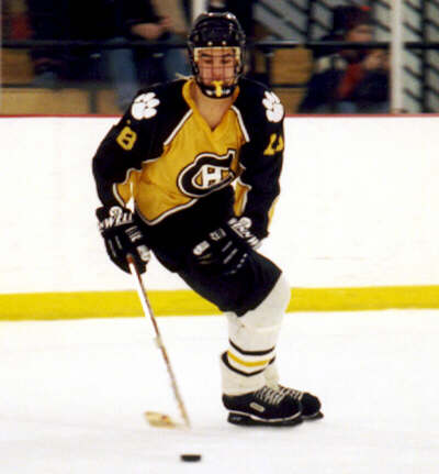 Mike Ruflin retrieves a puck from the defensive zone.