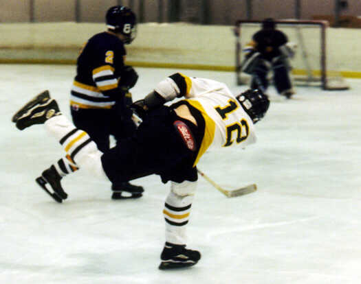 Andrew West follows through on a shot.