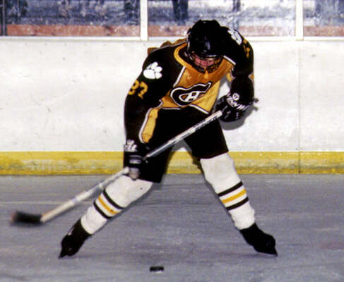 Andrew West punishes the puck.