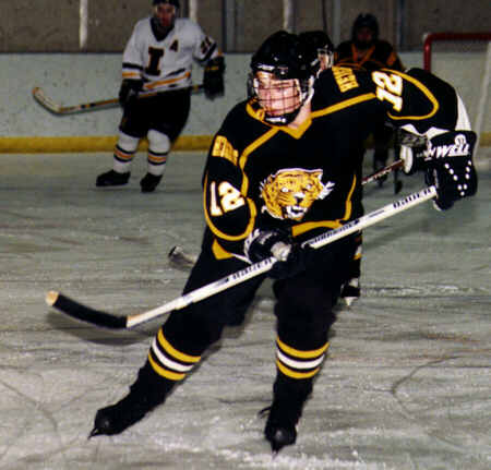 Andrew West skates after the puck.