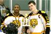 Ethan Farris and Dan Crowell receive the championship trophy for the Heights Holiday Tournament.