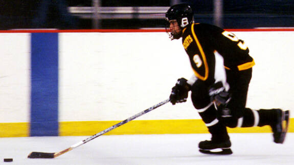 Lee Allen breaks the puck out of the defensive zone.