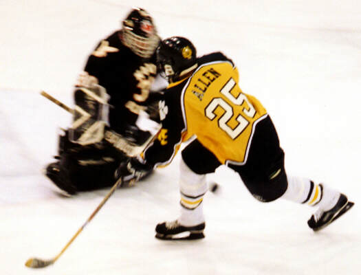 Lee Allen attacks the North Olmsted net.