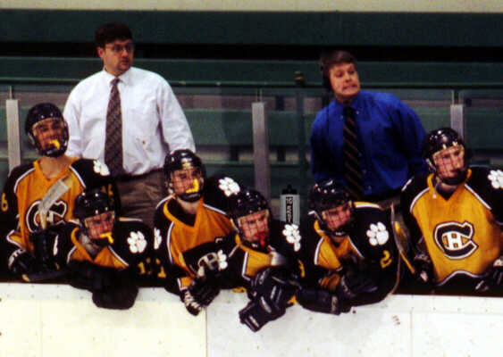 The Tigers' bench reacts to a play against North Olmsted.