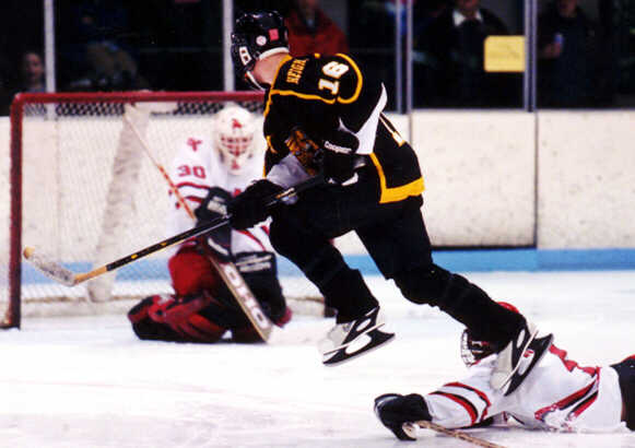 Milton Carter hurdles a fallen Raider.
