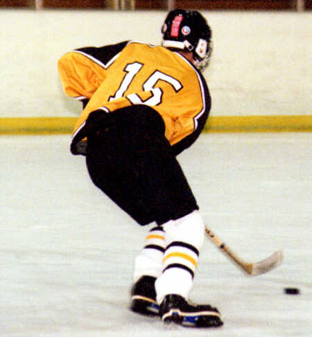 Pat Collins advances the puck against Lake Catholic.