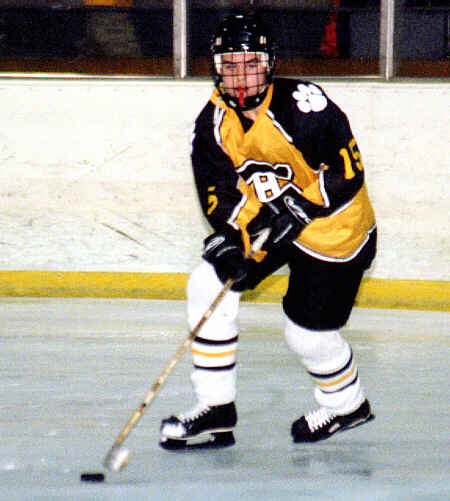 Pat Collins looks up ice to find an open forward.