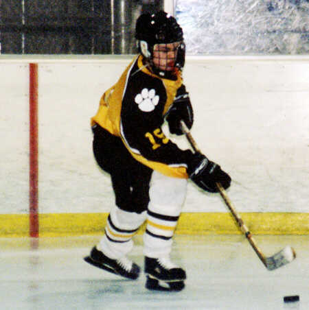 Pat Collins maneuvers the puck out of a corner.