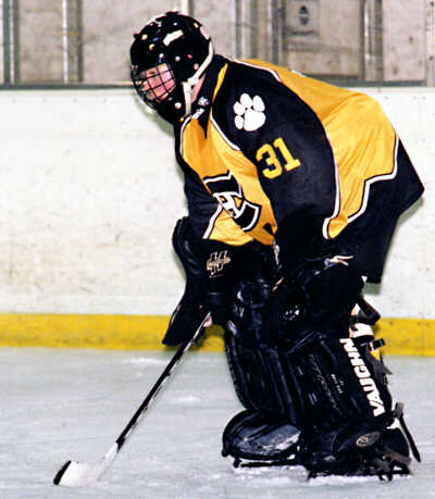 Matt Crowell protects the net against the Erie McDowell Trojans.