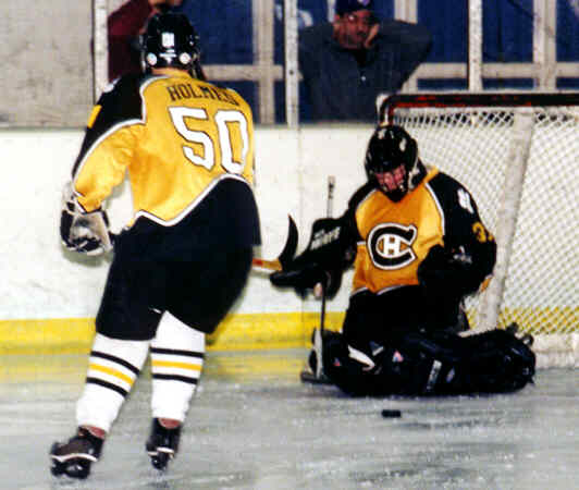 Jeremy Holmes and Matt Crowell attempt to contain a rebound.