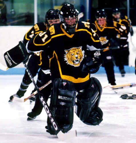 Matt Crowell leads the Tigers onto the ice against Shaker.