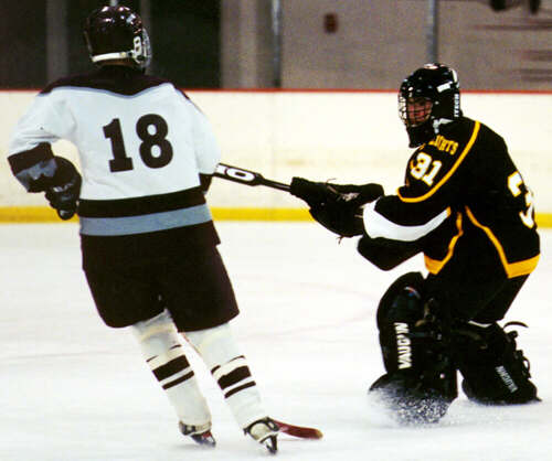 Matt Crowell steers a loose puck out of harm's way.