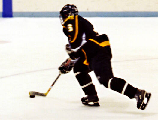 Jeremy Holmes takes off with the puck.