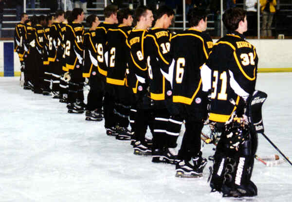The Tigers line up against Lakewood wearing brand new black sweaters.