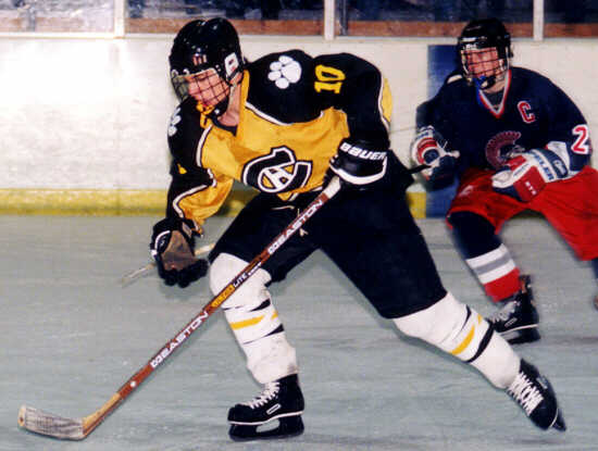 Doug Turner rushes past an Erie McDowell Trojan.