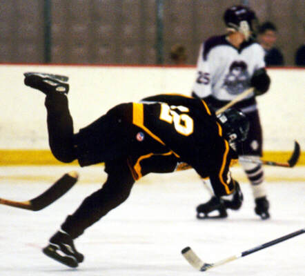 Andy West is upended after taking a shot against Rocky River.