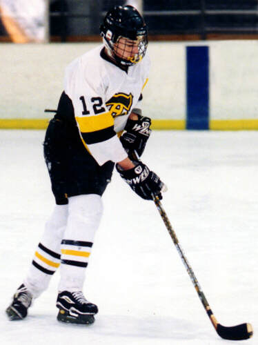 Andy West handles the puck.